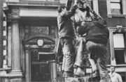 Workers preparing Le Marteleur in order to move it in front of Mudd Hall